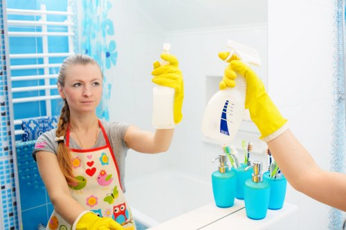 Office cleaners working in a modern SE16 workplace reception area
