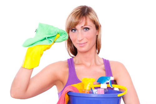 Professional carpet cleaner working in a modern SE16 apartment
