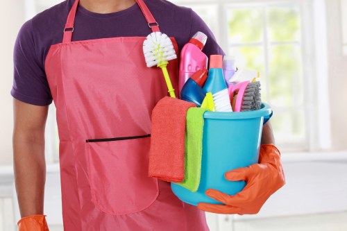 Office cleaning team working in a modern SE16 workplace